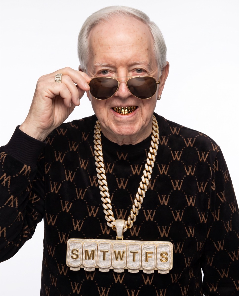 Grandpa Drip lowering his sunglasses with a gold grill smile